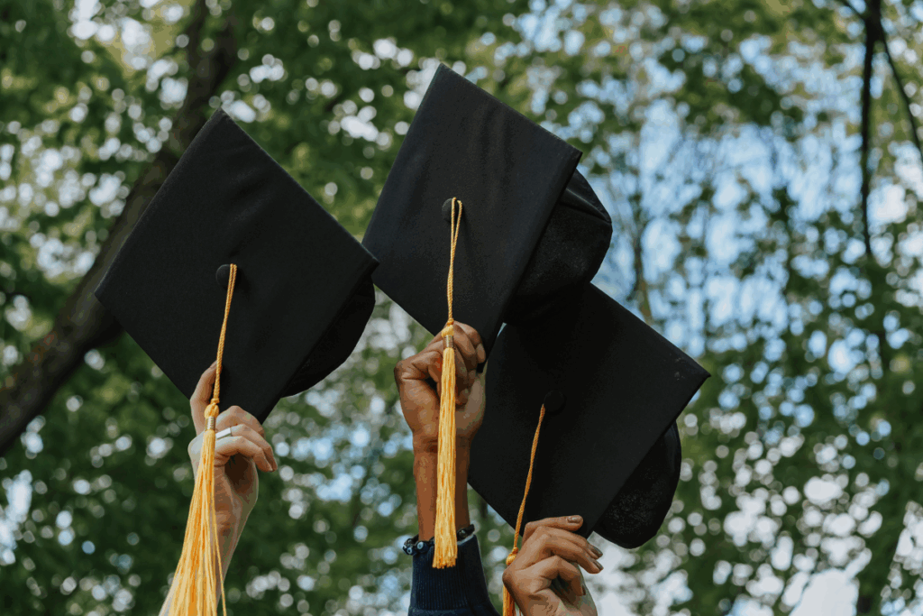 graduation caps in the air