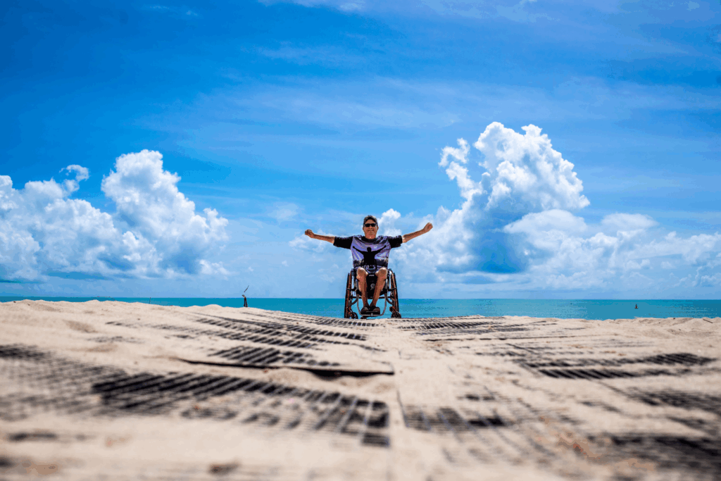 Man in a wheelchair on the beach
