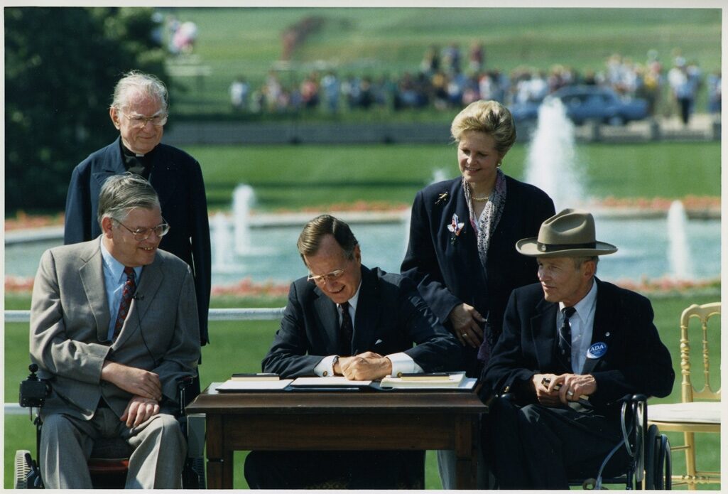 President George Bush signing the Americans with Disabilities Act, 1990