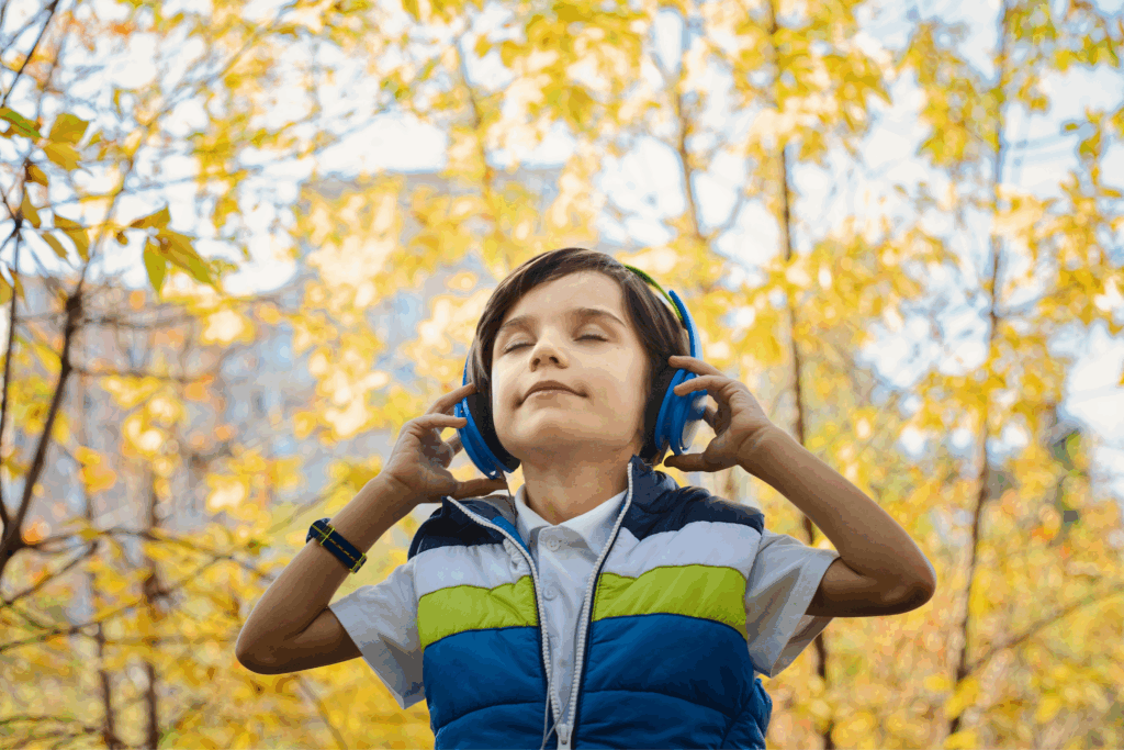 child wearing headphones displaying a calm demeanor