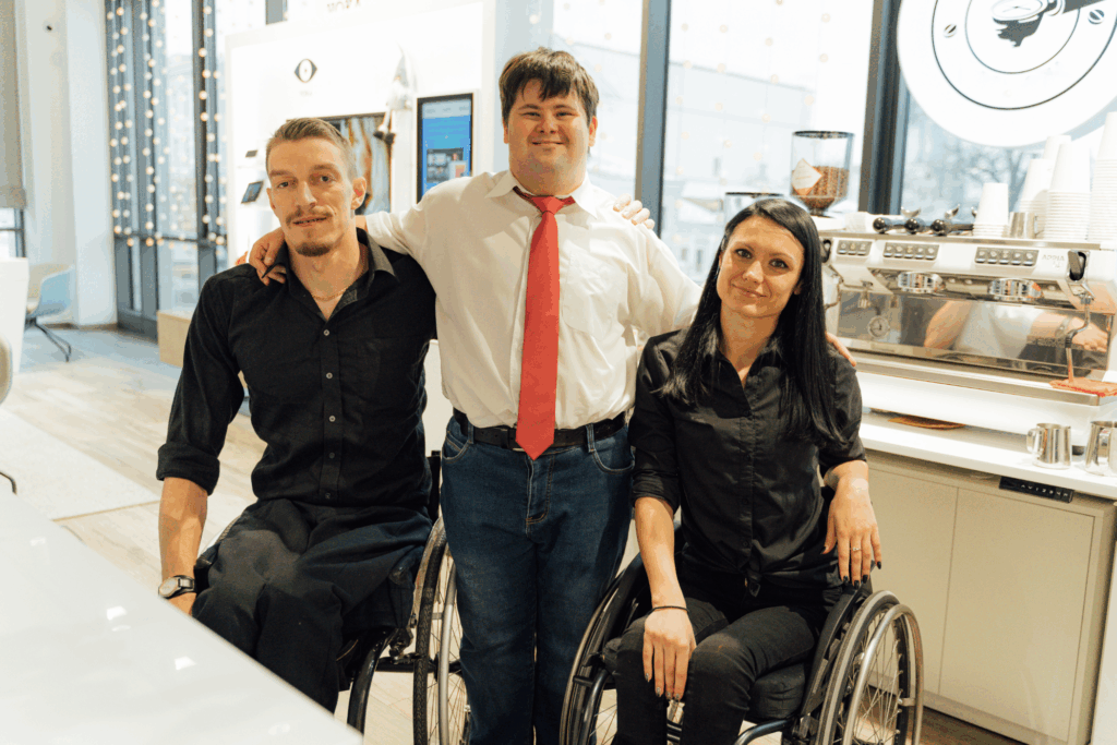 three individuals with disabilities in an office setting