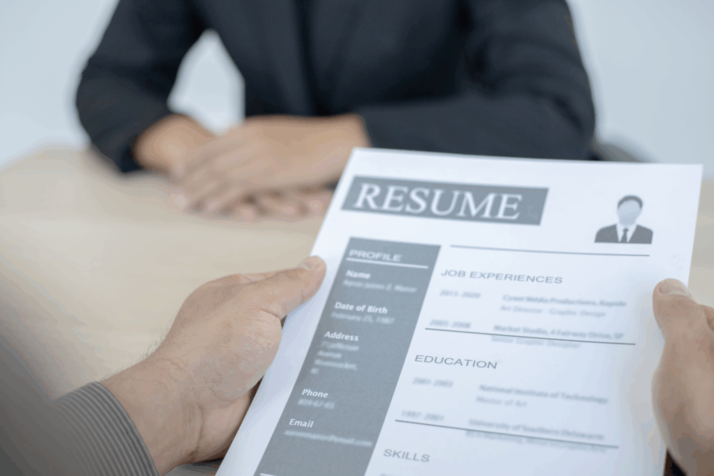 closeup of someone holding a resume