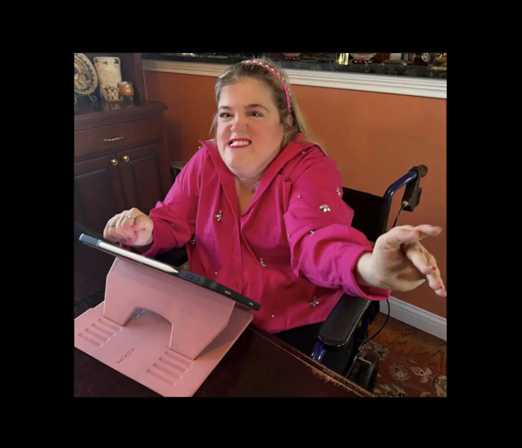 A person in a bright pink shirt using an ipad framed in a black border